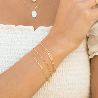 stack of permanent jewelry bracelets
